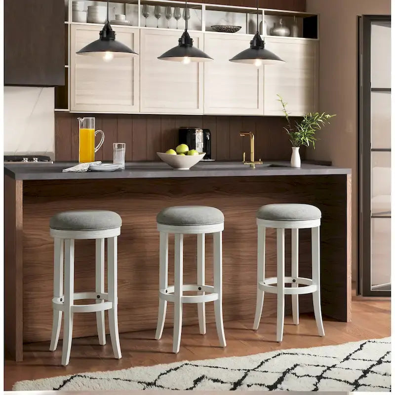 Tabouret de bar pivotant sans dossier en bois blanc avec siège en tissu gris